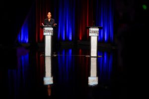 Bottoms Stands Before Empty Podium as Jackson Campaigns with Kemp Instead of Debating